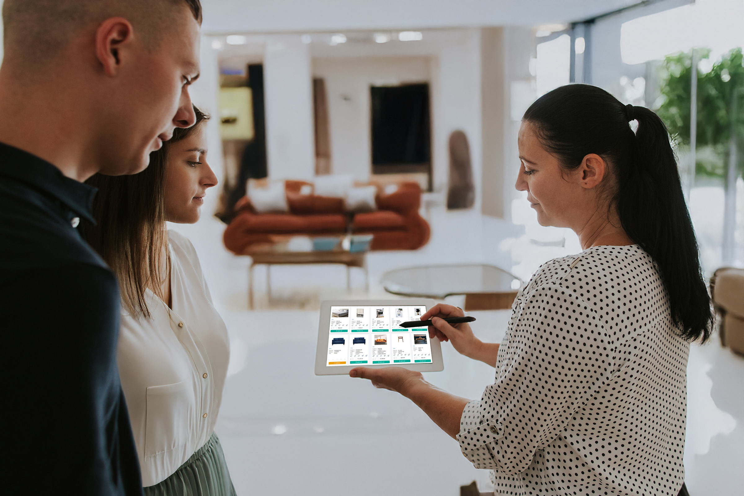 saleswoman showing couple the PointCentric platform